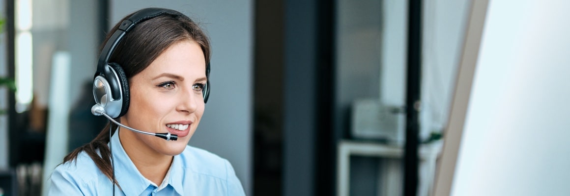 Receptionist speaking over headphones